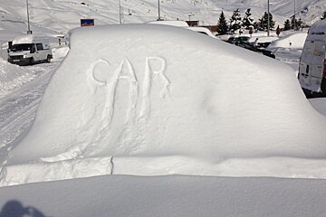 car buried in snow