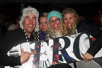 an image of people with a snowboard in a bar