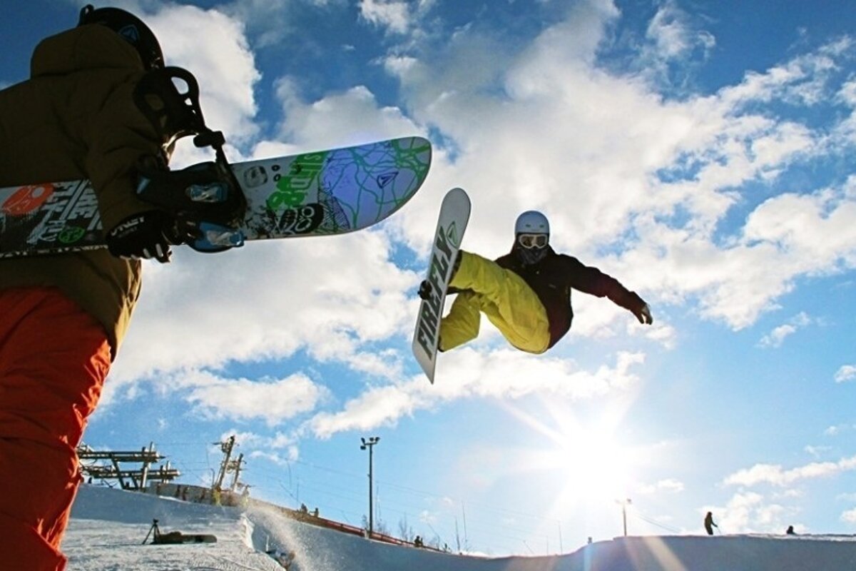 an image of a snowboarder in the halfpipe