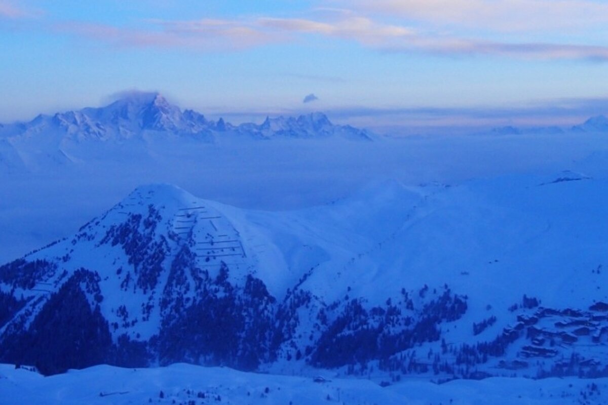 an image of sunrise in the mountains