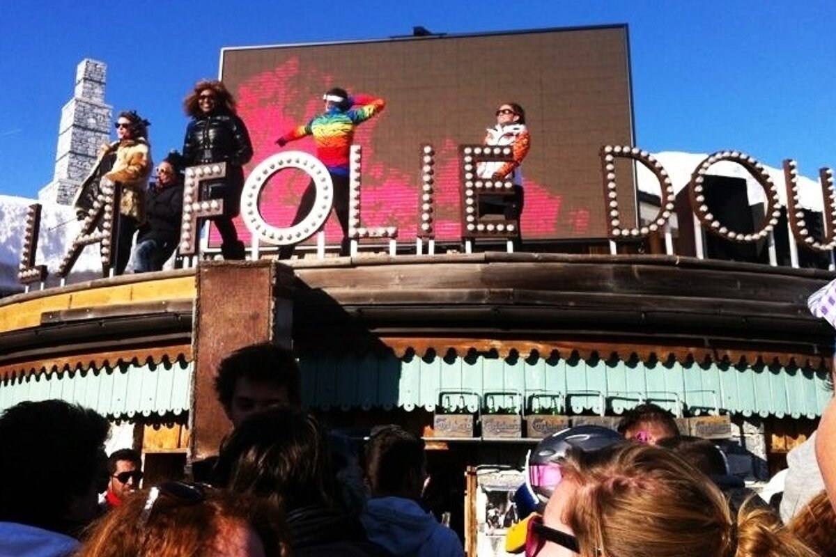 an image of people dancing on the folie douce roof