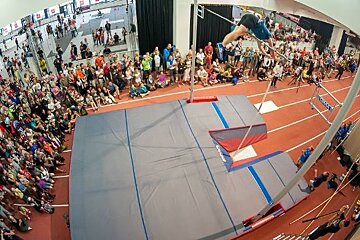 Man pole vaulting indoors tignes