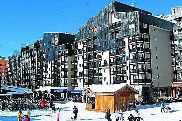 image of large apartment blocks on the side of the pistes