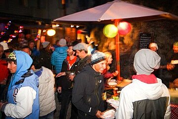 An image of a DJ playing to a crowd of dancing people at an apres-ski bar in Chamonix Mont Blanc