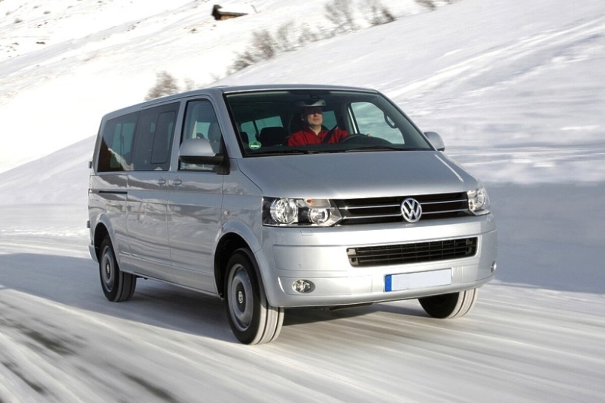 an image of a vw caravelle minibus travelling on snow