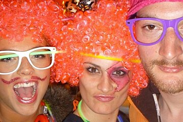 an image of people in fancy dress and wigs and make up