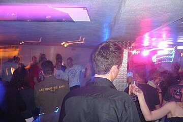 A man wearing a jacket that says mx 1000 bb ams