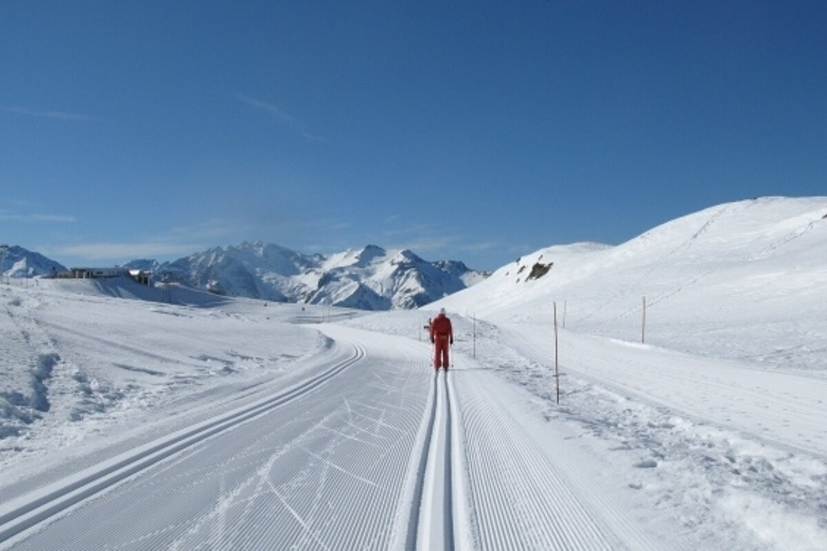 Cross country skier path with instructor ahead