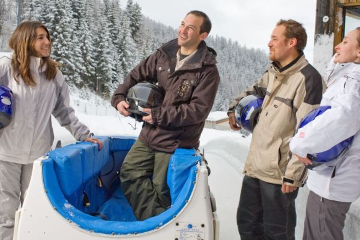 people at the end of the bobsleigh track in la plagne