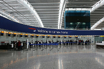 An airport with a sign that says welcome to our new home