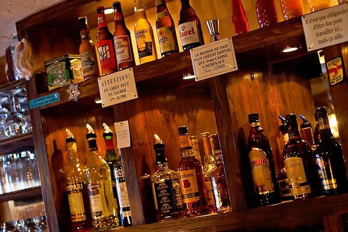 an image of a bar full of bottles of liqueurs and brandy and whiskey