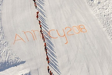 An aerial view of skiers on a snowy slope with the year 2008 written in orange