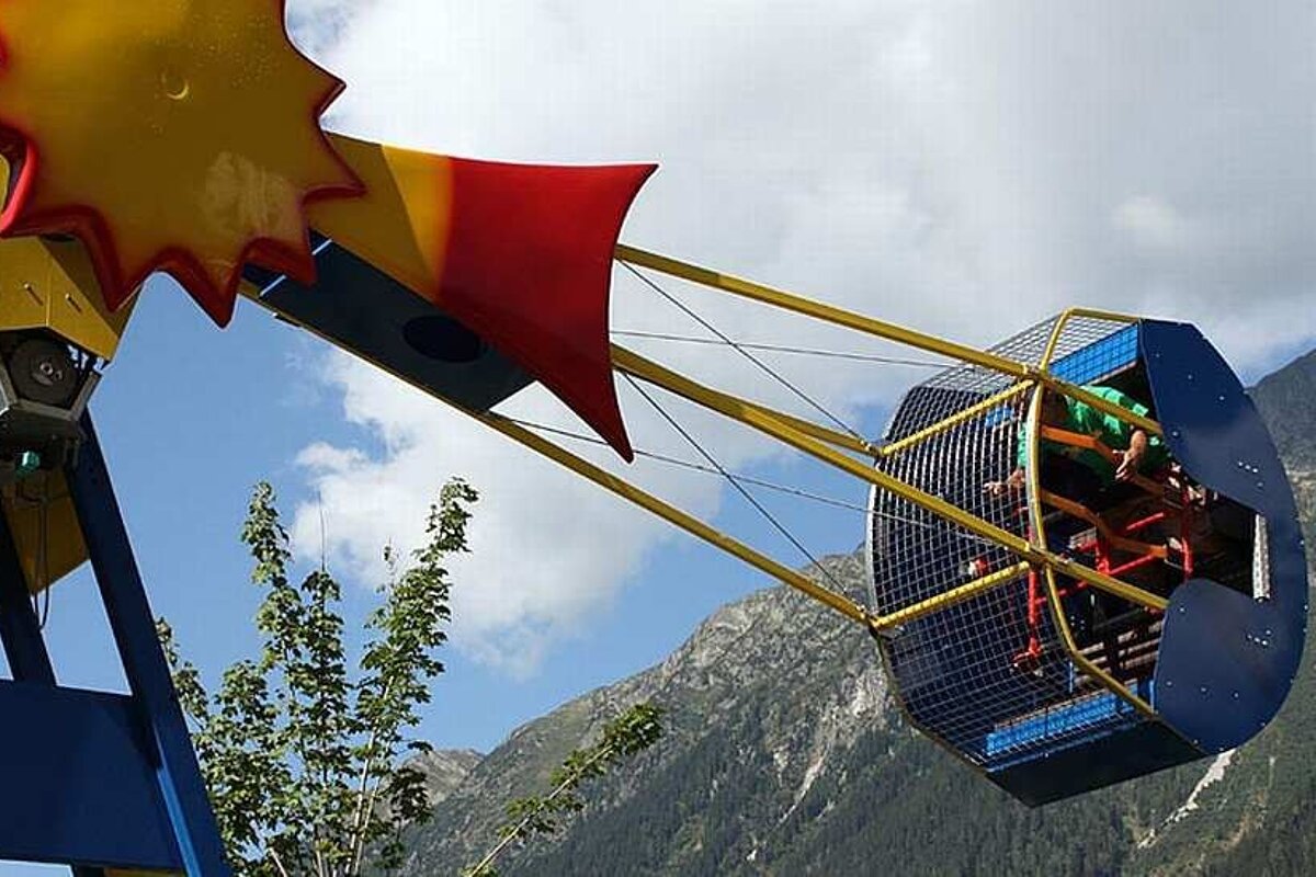 an image of a fairground ride spinning around