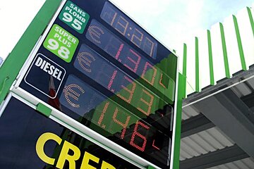 A digital sign displays the price of diesel and super plus 98