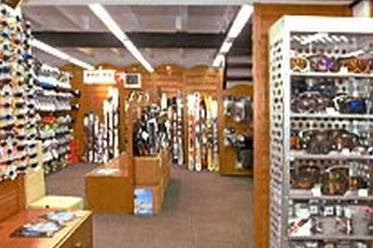 A store filled with lots of skis and sunglasses