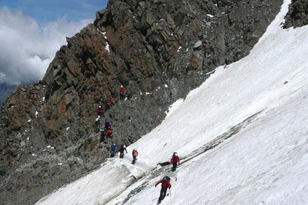 An image of climbers crossing the Couloir du Gouter, Mont Blanc, Chamonix