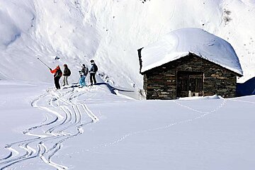 An image of clients skiing touring off piste with Bureau des Guides de Meribel