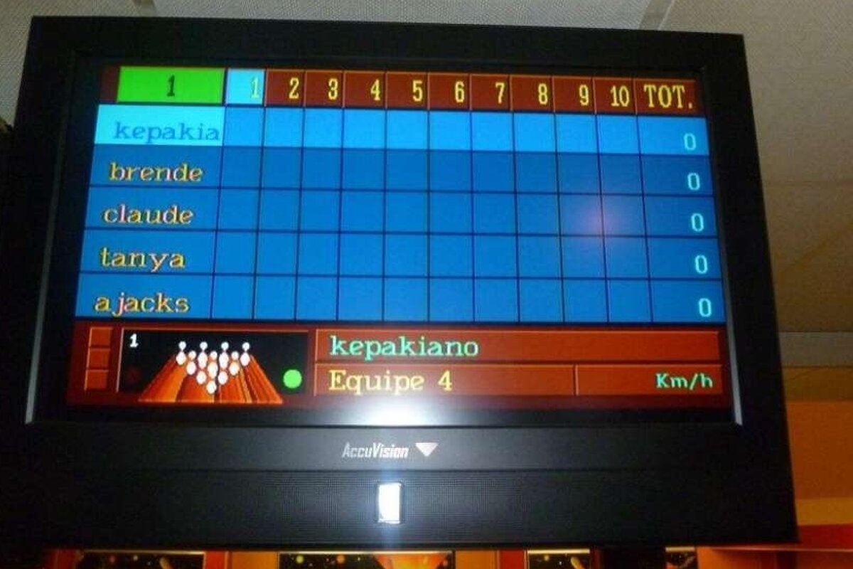 A scoreboard at a bowling alley shows the score as 1 to 10