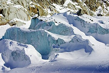 A snowy mountain covered in ice and rocks