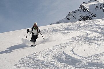 girl skiing in powder snow