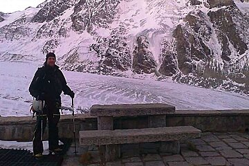 An image of Lee snow reporter hiking on a snowy glacier and mountains in Verbier