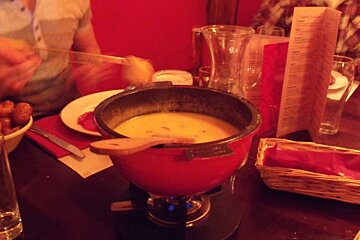 a chiili cheese fondue cooking at the Lounge 21 restaurant in Alpe d'Huez