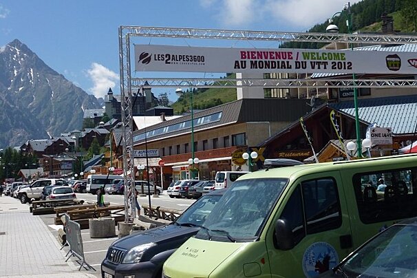 an image of a sign over the road welcoming you to town