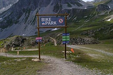 an image of a gate with biking trail markers on it