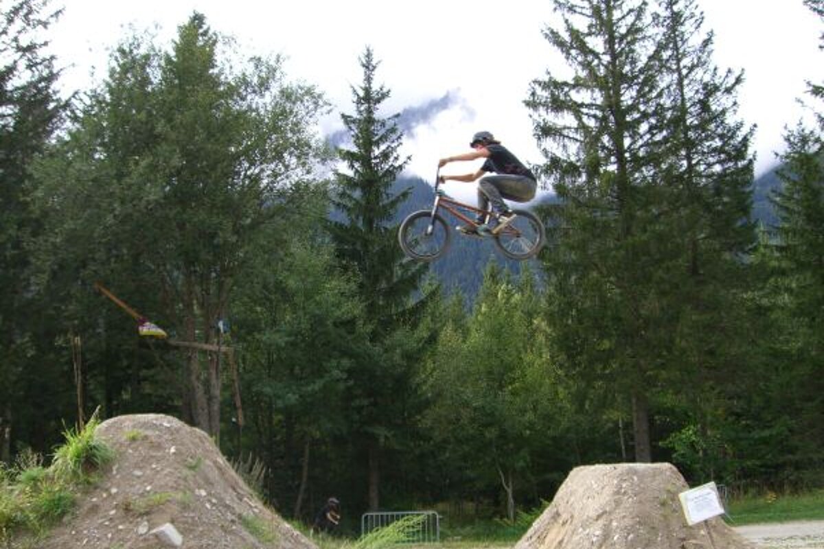 A man is riding a bike in the air