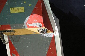 A climbing wall with a sign that says kit crimpe