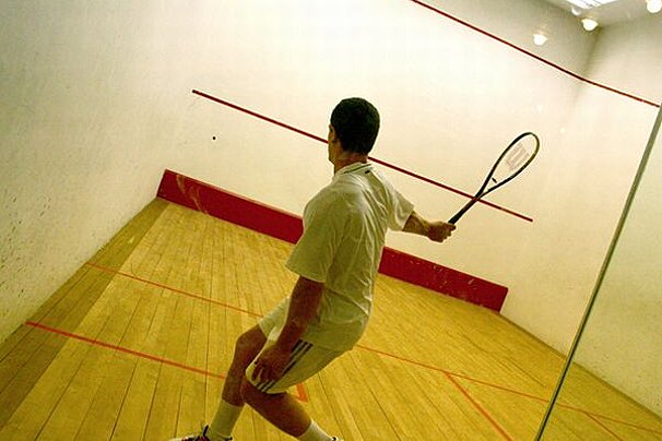 a man playing squash