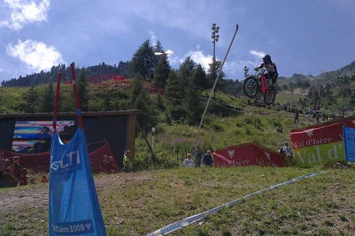 an image of a man on a mountain bike jumping high