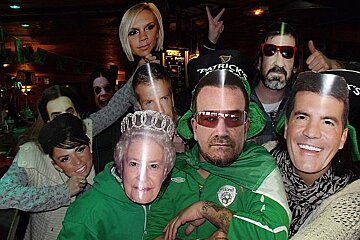 A group of people wearing face masks including one that says patrick 's