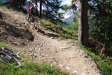 A person riding a bike down a dirt trail
