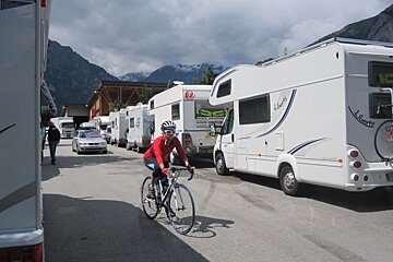 rows and rows of motor homes parked up in a summer resort