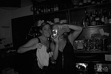 A black and white photo of two women taking a selfie