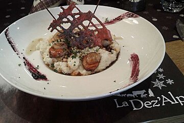 an image of a bowl of food with a beetroot coloured lattice on top