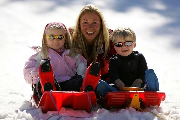 An image of a Ski Famille nanny sledging with children, Morzine, Les Gets, Val Thorens, Reberty