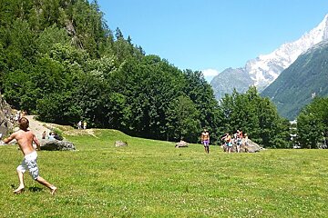 An image of people playing frisbee at the climbing wall at Les Gaillands in Chamonix Mont Blanc