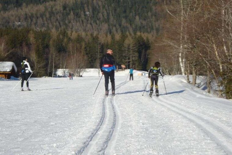 Family cross country skiers in Chamonix ski de fond