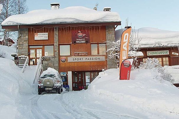 A snowy building with a sign that says sport passion