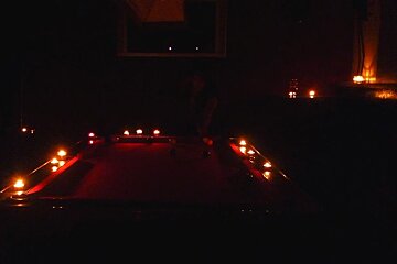 An image of someone playing pool in the dark during a blackout in Chamonix Mont Blanc