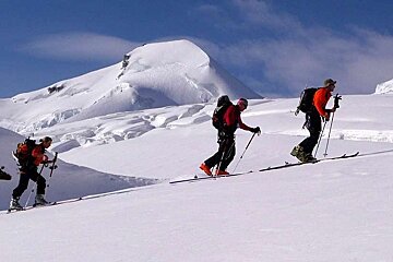 An image of clients skiing touring off piste with Bureau des Guides de Meribel