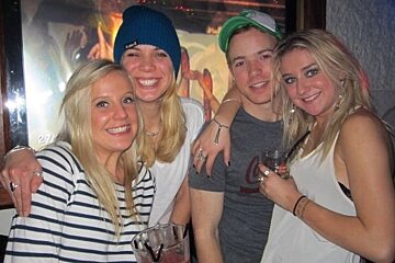 4 people posing for photos