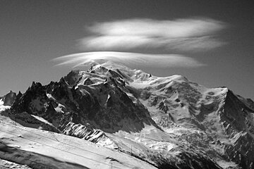 A black and white photo of a snowy mountain