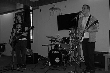A black and white photo of a yamaha drum set
