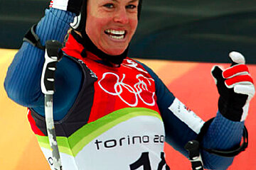 A female skier wearing a torino 20 jersey
