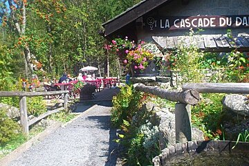 An image of a restaurant and bar with terrace and flowers in the mountains in Chamonix Mont Blanc