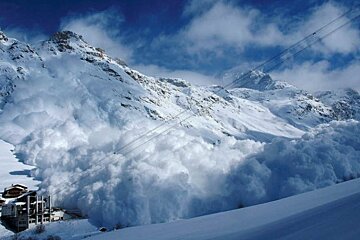 picture huge avalanche swallows Le Fornet in Val d'Isere