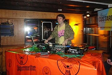 DJ turning tables in bar